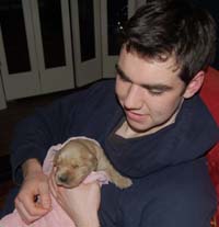 Zach and with one of our puppies from our last litter.