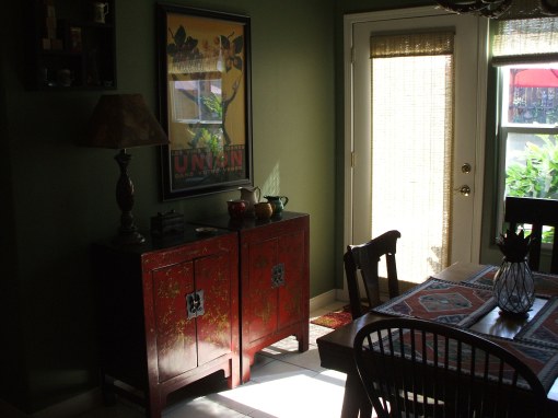 A lovely pair of red decorated chests placed side by side add a further infusion of Asian to this CA home.